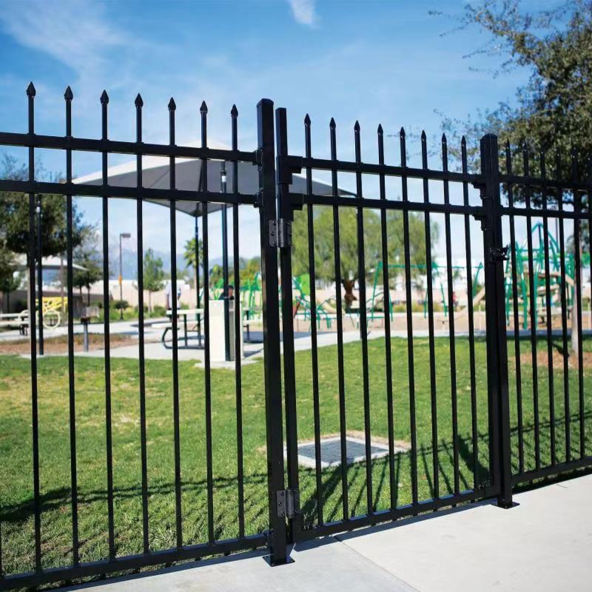 Black pedestrian aluminum garden gate matched to fence panels