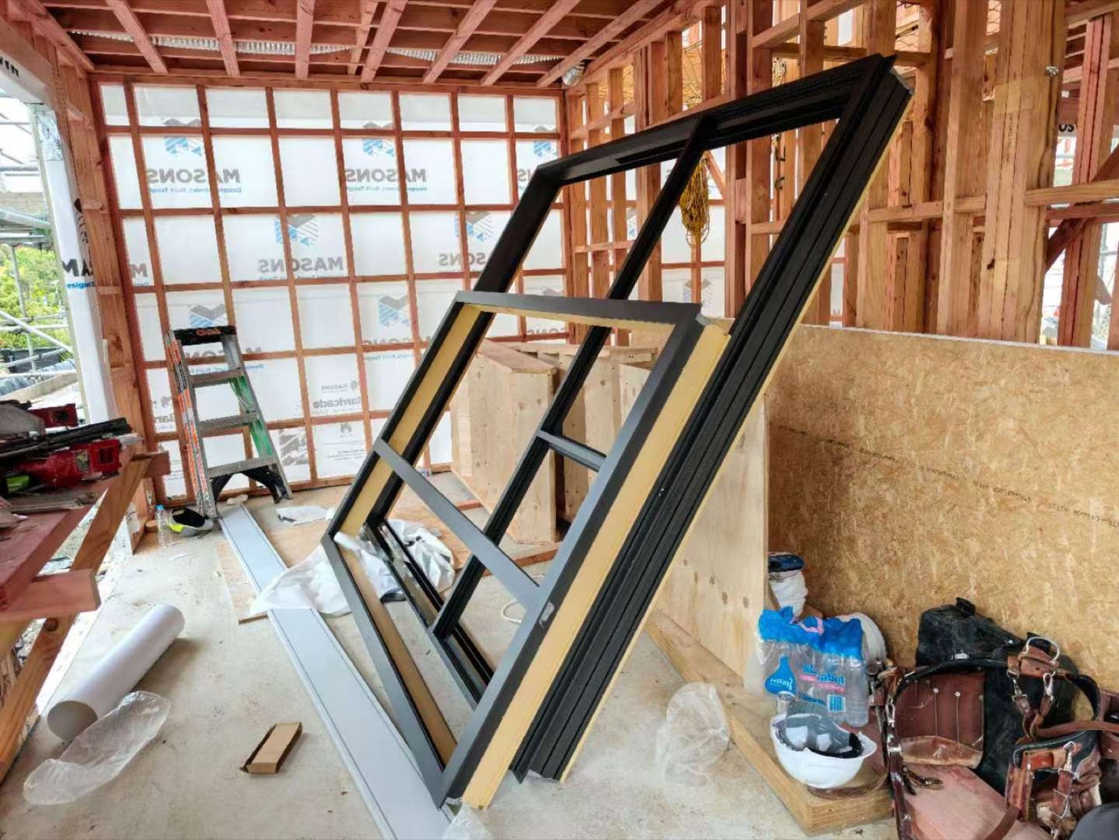 Window system positioned within construction framing
