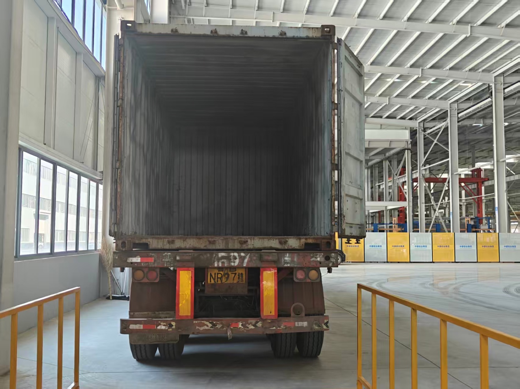 Container loading area inside factory environment